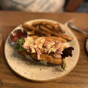 Sea Level NC signature dishes Oysters (raw and prepared), Lobster Roll, NC Fish & Chips, Shrimp & Grits, daily fresh catches.